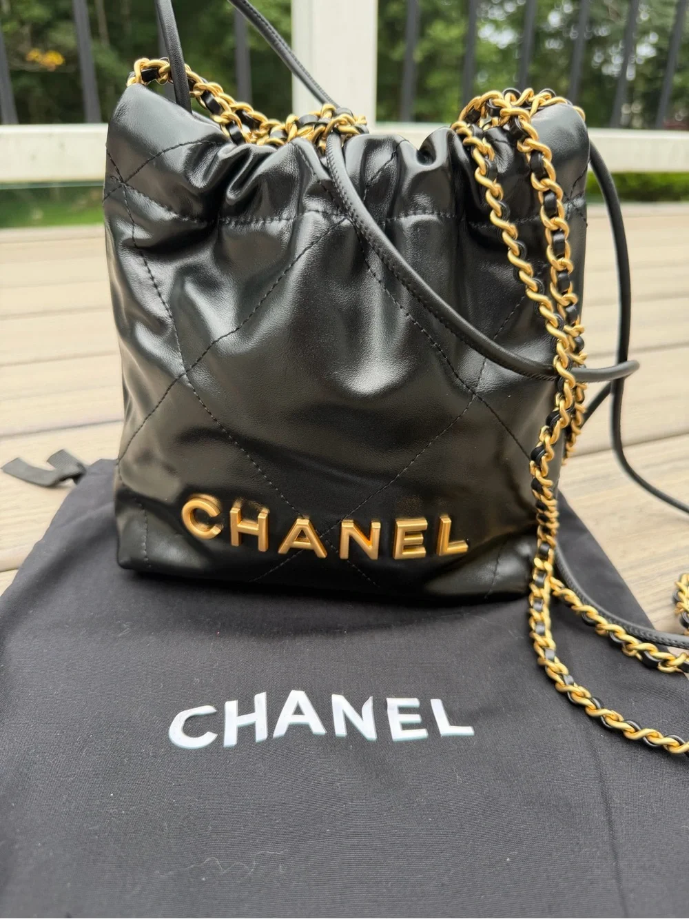 CHANEL Black Quilted Leather Drawstring Crossbody with Gold Chain
